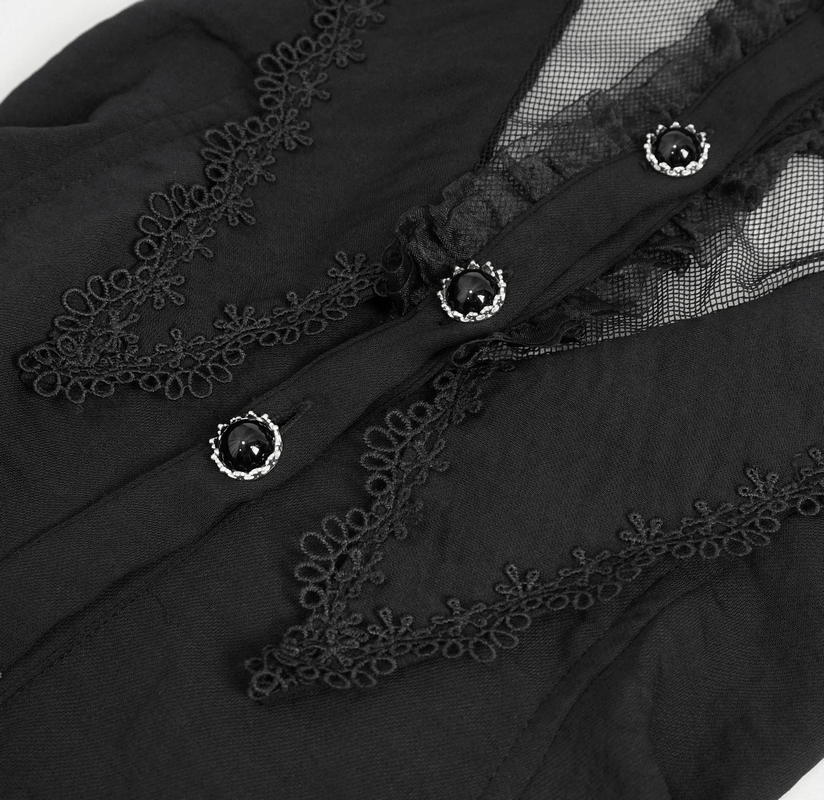 Close-up of gothic black blouse with intricate lace and decorative buttons showcasing a sleeveless design and transparent accents.