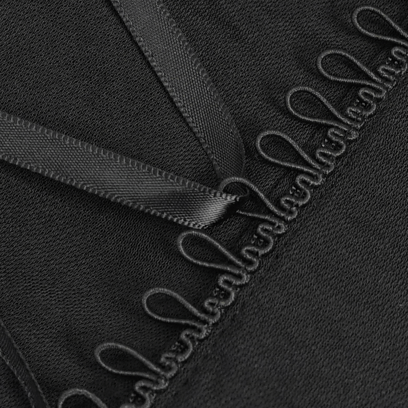 Close-up of black halter blouse detail featuring elegant loops and satin ribbons, perfect for a gothic wardrobe.