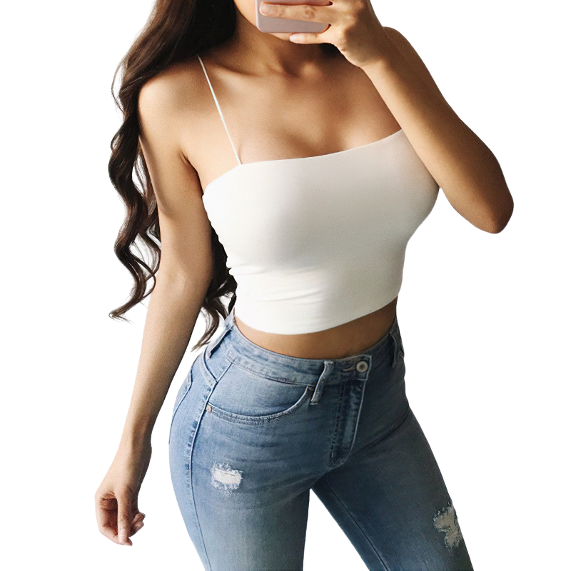Elegant women's sleeveless white crop top with skinny straps, paired with stylish blue jeans.