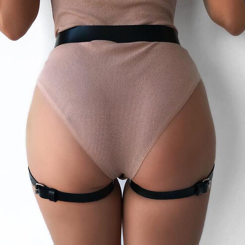 Gothic black leather leg harness fitting a woman's body for edgy fashion style and sexy allure.