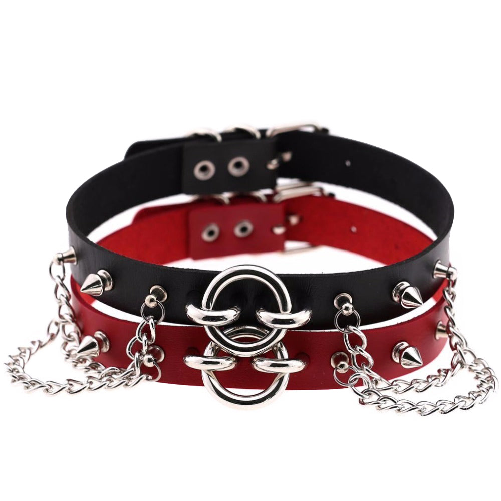 Bold PU leather choker with spikes and dangling chains for a gothic rock star look.