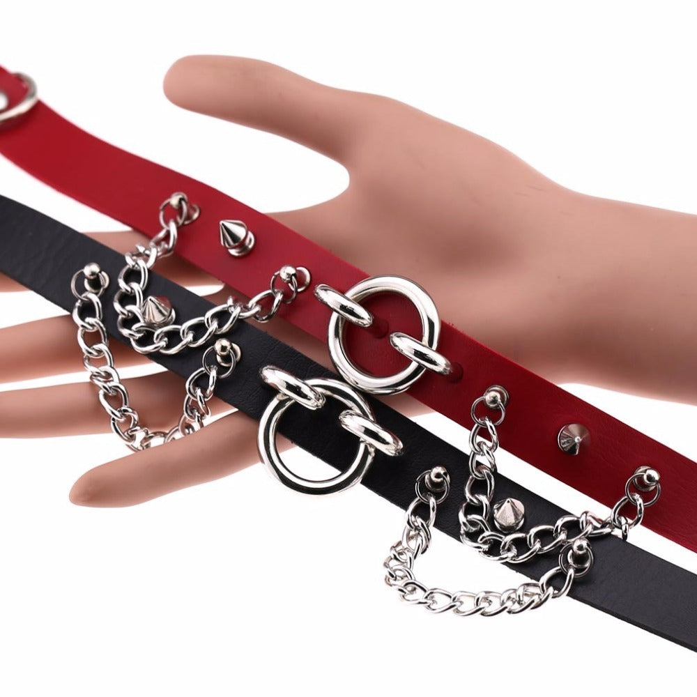 Stylish sexy collar choker with spikes and chains in red and black PU leather for gothic rock fashion accessories.