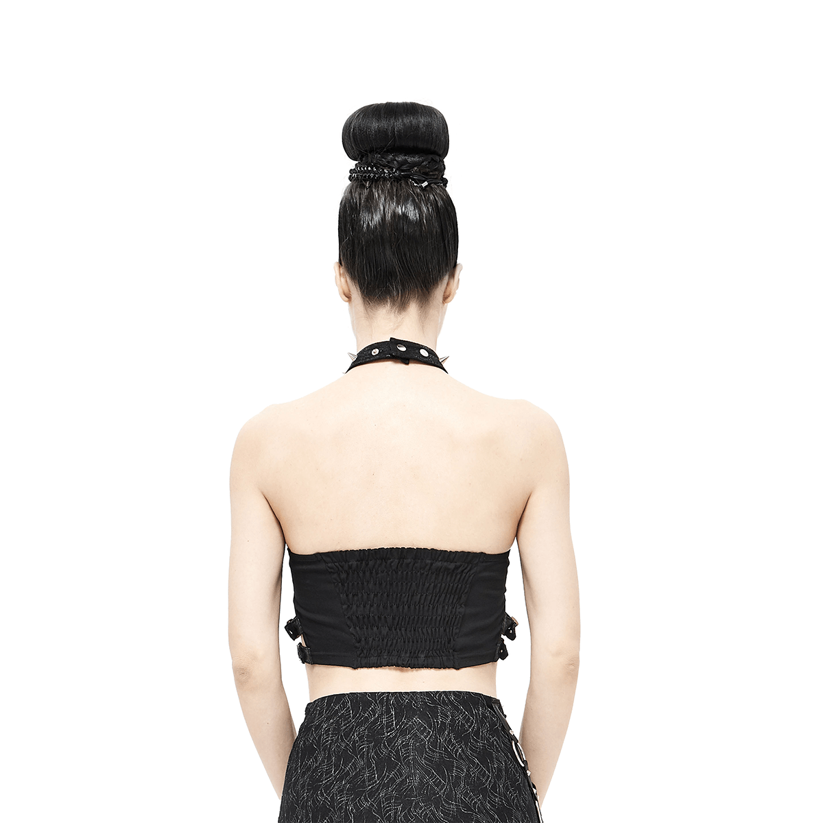 Back view of a women's black crop top with buckles and spikes, showcasing gothic style fashion.