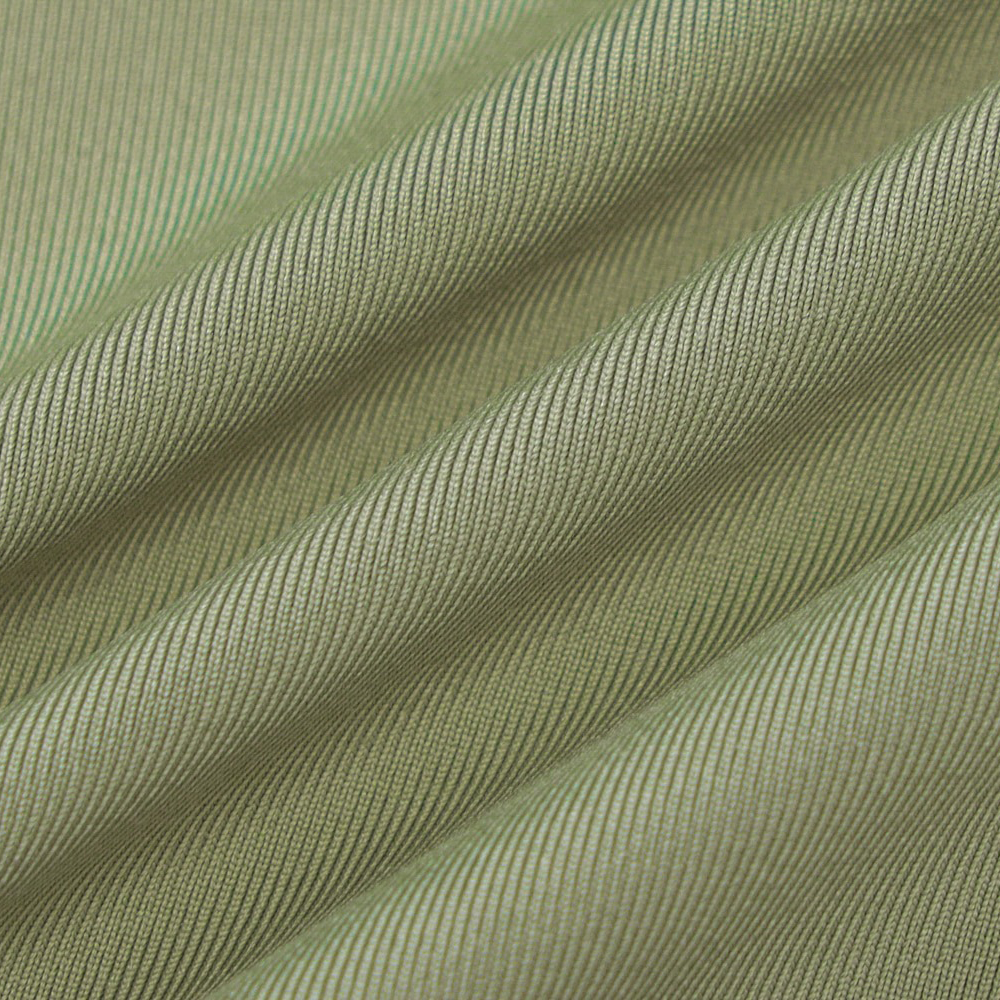 Close-up of soft olive green fabric with textured stripes, perfect for stylish alternative fashion tops.