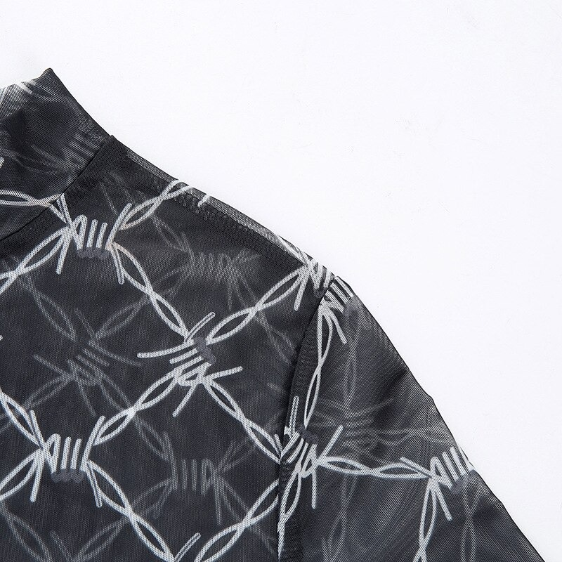 Close-up of a black long sleeve crop top with vintage mesh chain print for women, showcasing its stylish design.