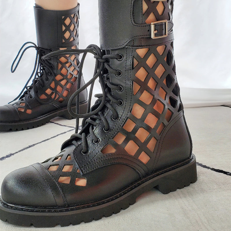 Sexy black leather boots with lattice design, metal buckle, and laces for a bold goth style.
