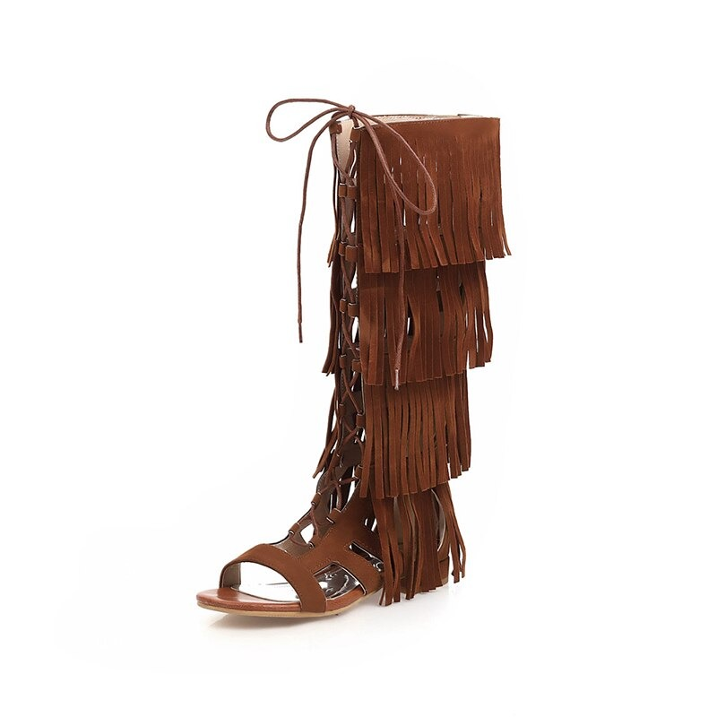 Stylish brown gladiator sandals with fringed details and open toe, perfect for festivals and casual outfits.
