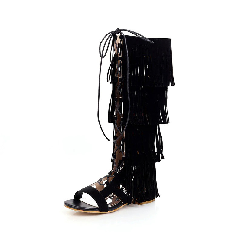 Glamorous black gladiator sandals with fringe, open toe, and lace-up design perfect for festivals and stylish outfits.