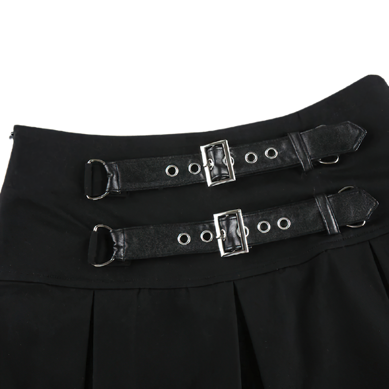 Close-up of a sexy gothic black mini skirt showcasing pleats and stylish buckles with rivets for a fierce rock-inspired look.