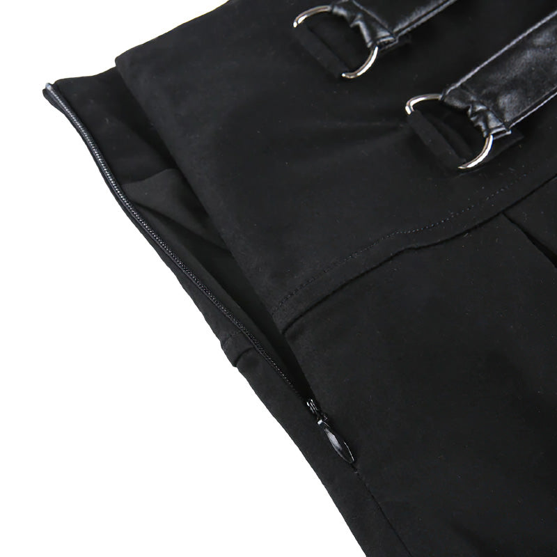 Close-up of a sexy gothic black mini skirt showcasing its pleated design and stylish buckles.