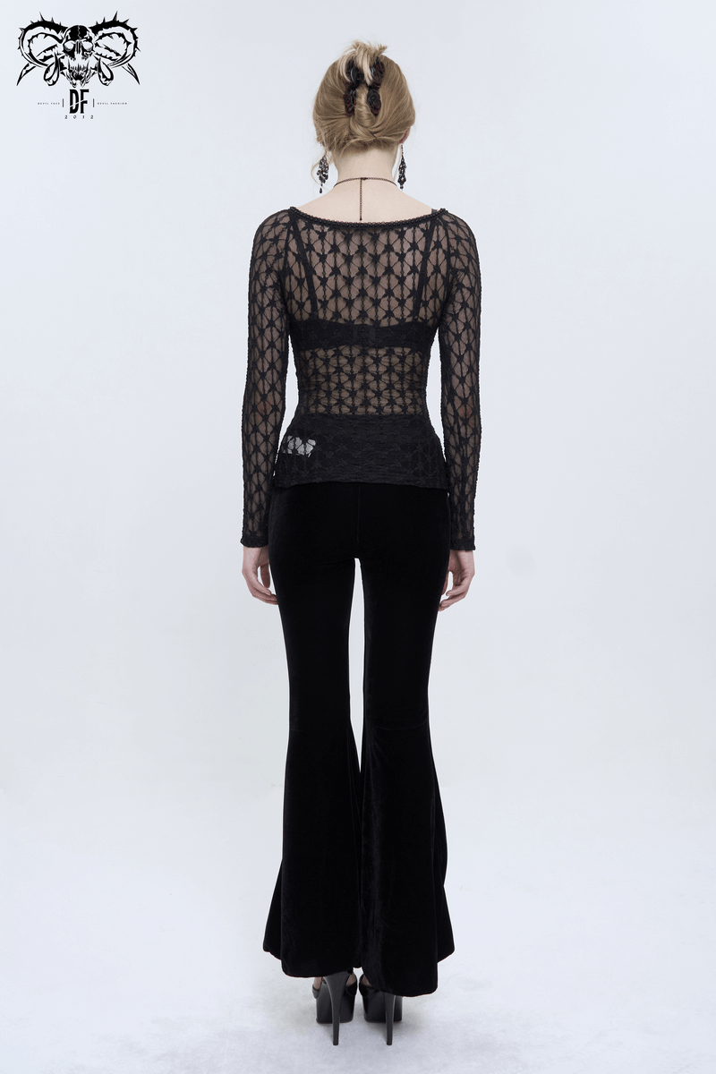 Woman wearing a sexy gothic lace top with red crystals and black velvet flared pants, showcasing a trendy punk style.