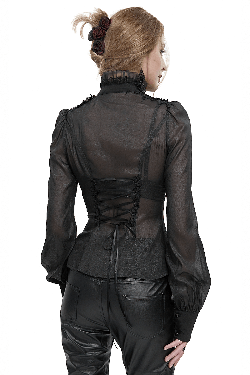 Women’s black gothic long sleeve ruffled blouse with strappy back, perfect for adding elegance to any outfit.