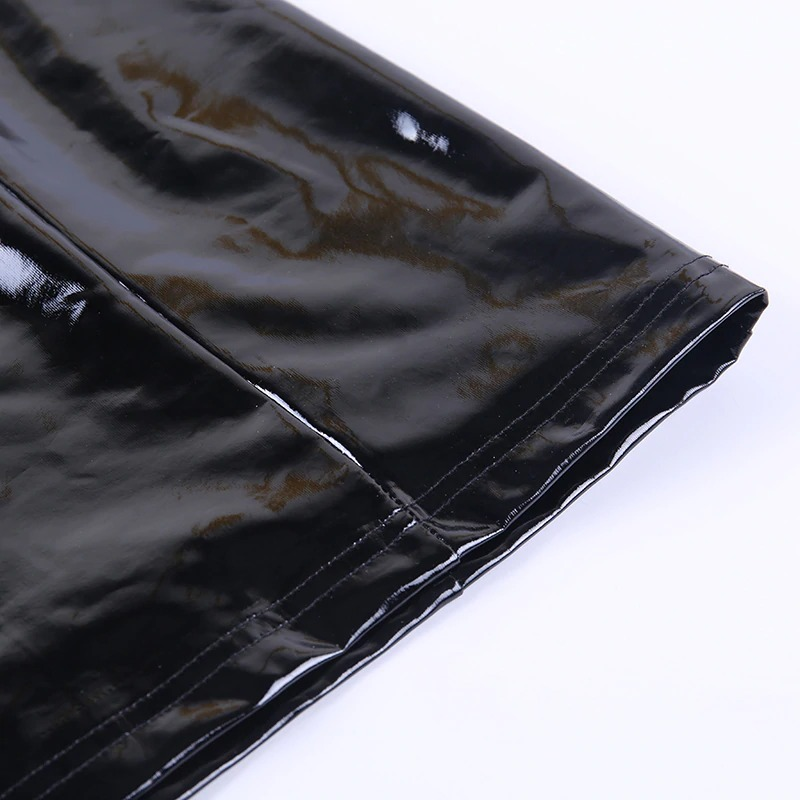 Close-up of the shiny black latex PU leather fabric of a sexy Gothic women's mini dress.