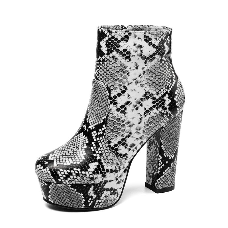 Stylish women's snake skin print ankle boots with pointed toe and high heel, perfect for fashionable casual looks.