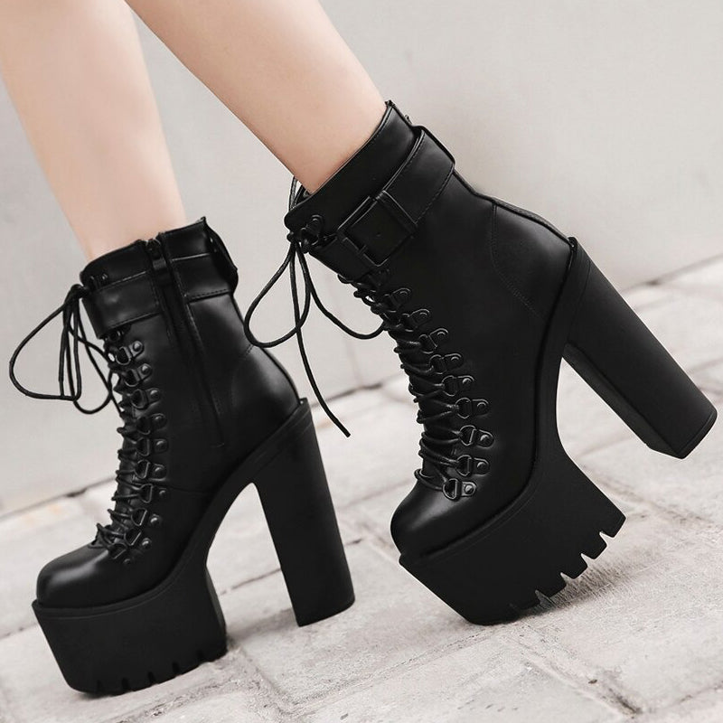 Stylish black laced platform ankle boots with high heels for women, perfect for rocker outfits.