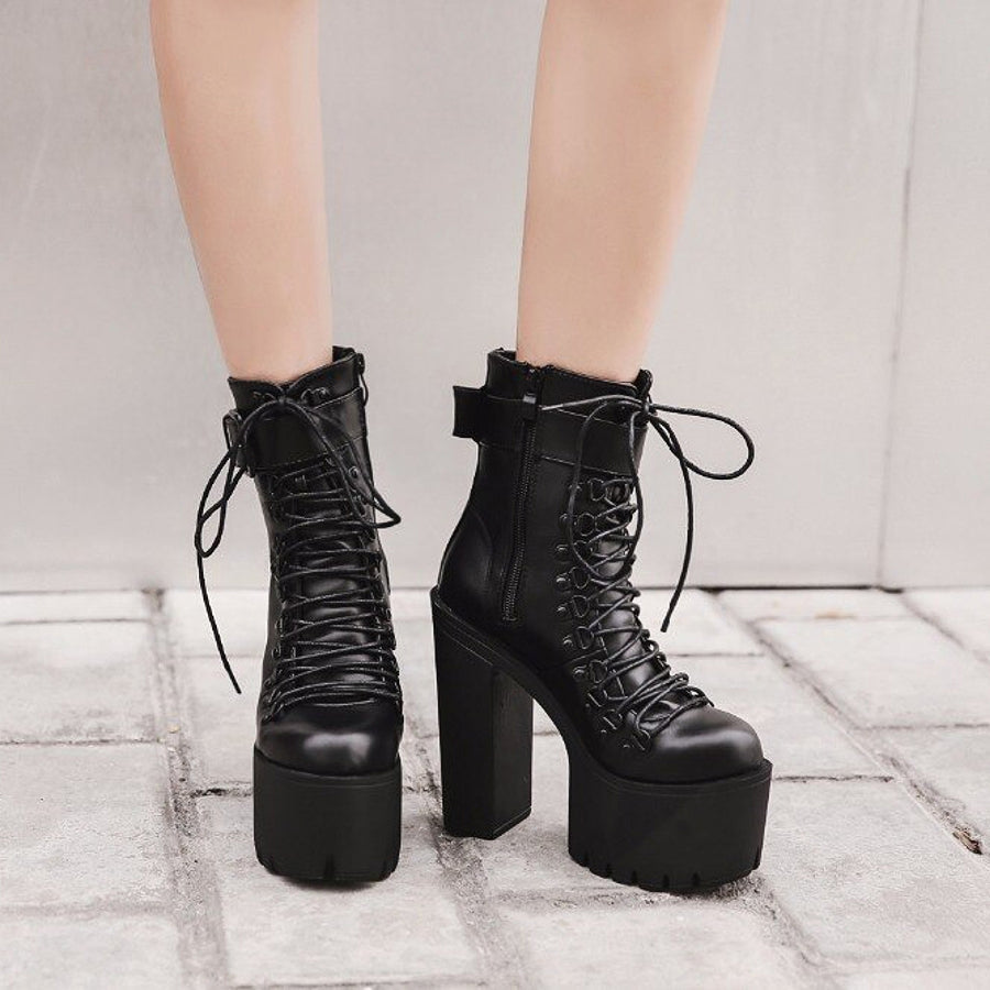 Stylish black laced platform ankle boots with high chunky heel, ideal for rocker outfits and all-weather wear.