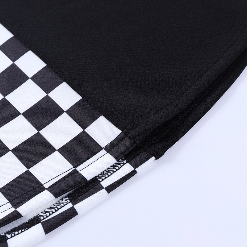 Close-up of women's sexy high waist mini skirt featuring black and white plaid pattern, perfect for summer aesthetic streetwear.