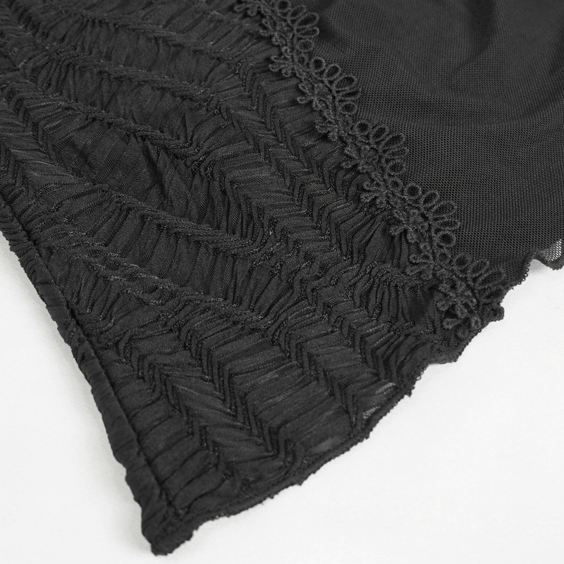 Close-up of black lace detailing on a fashionable Gothic T-shirt, showcasing ruffled texture and elegant design.