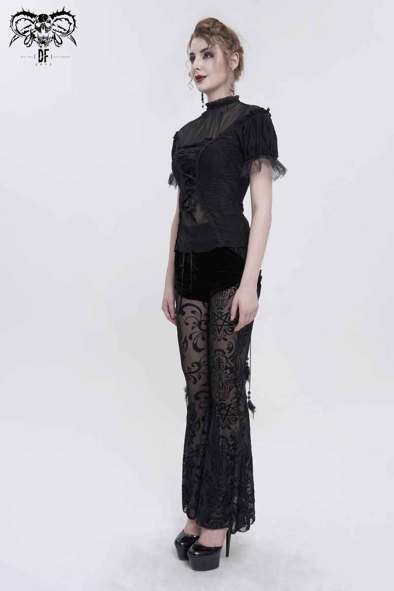 Gothic fashion model wearing a black lace ruffle sleeves t-shirt and stylish black sheer pants.
