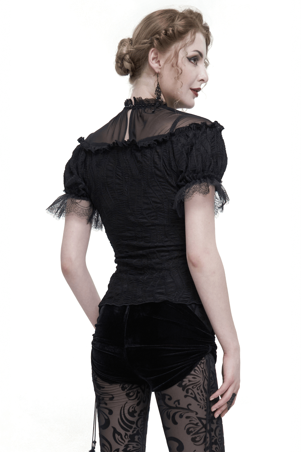 Gothic black T-shirt with lace ruffle sleeves and stand collar, styled with velvet pants.
