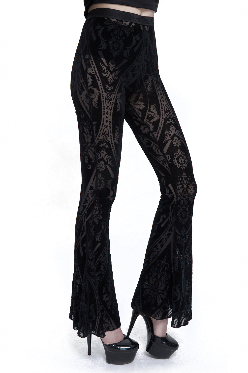 Elegant black slim fit flared pants with a gothic pattern, accentuating curves and perfect for a trendy look.