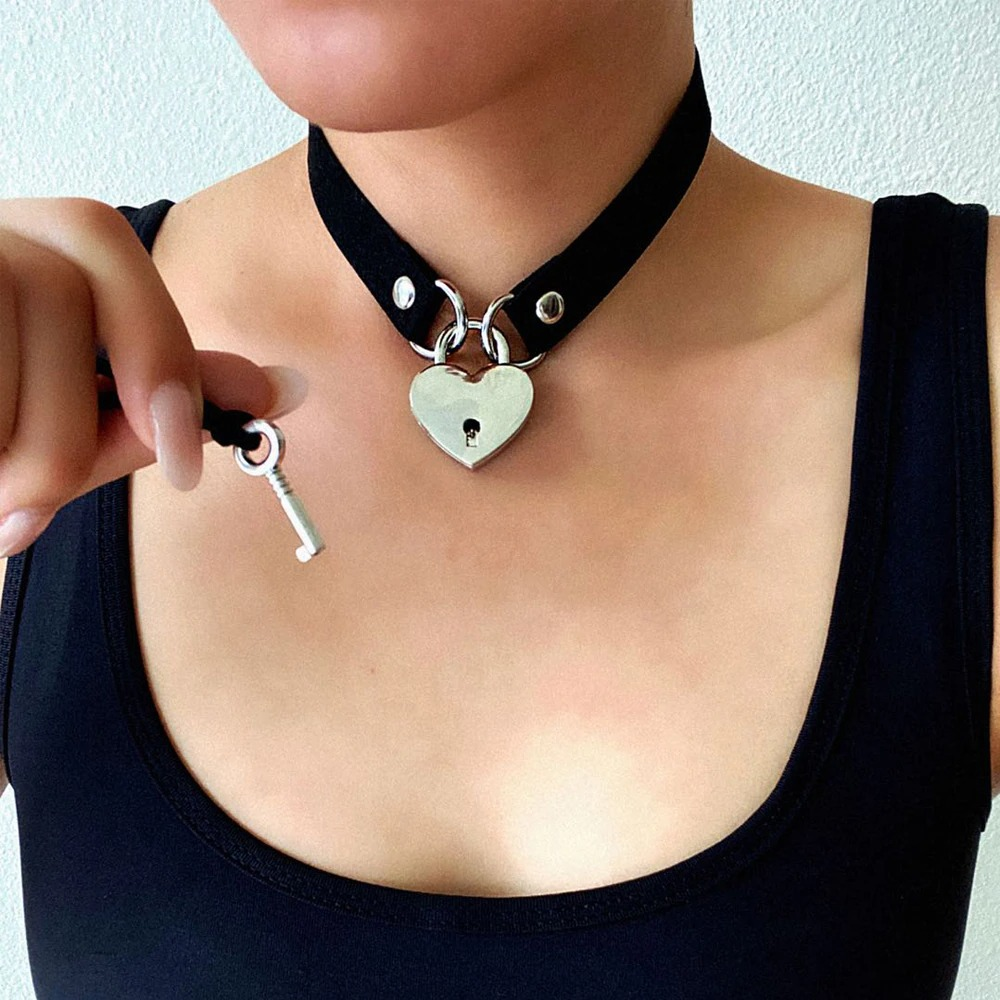 Stylish women's steampunk heart choker collar with silver key pendant for alternative fashion lovers.