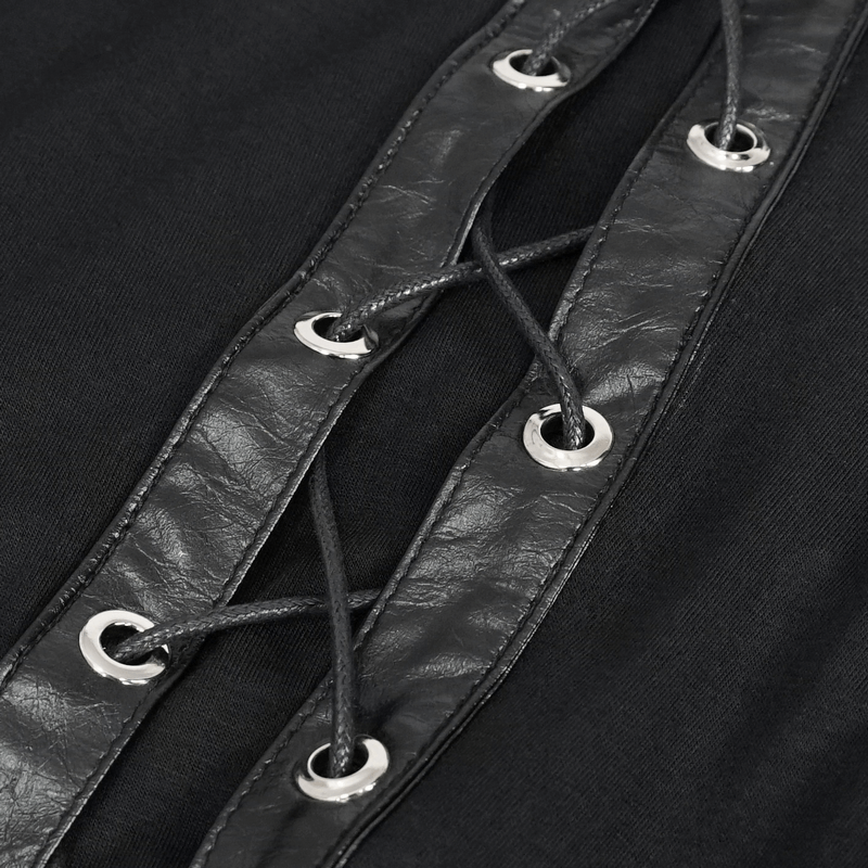 Close-up of lace-up detail on a women's gothic top, featuring black fabric and silver grommets.