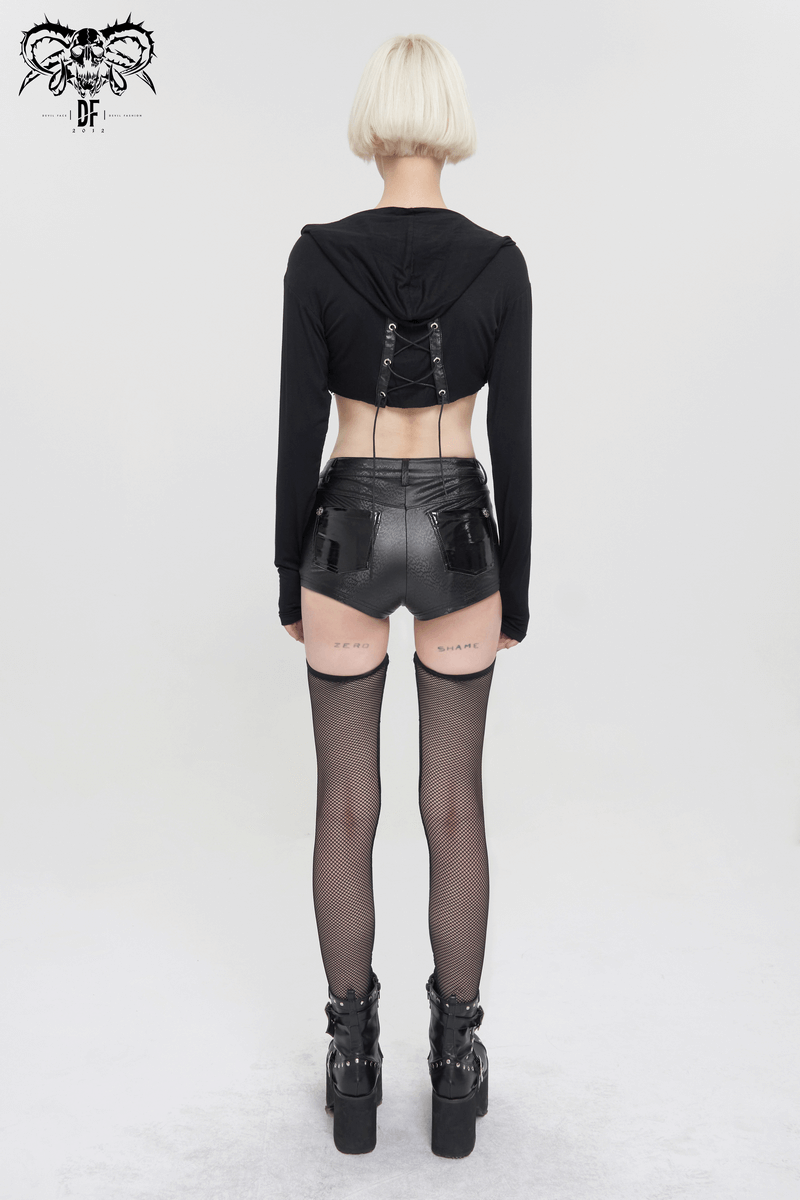 Back view of a woman in a black lace-up hoodie, shiny shorts, and thigh-high stockings, showcasing a chic gothic style.