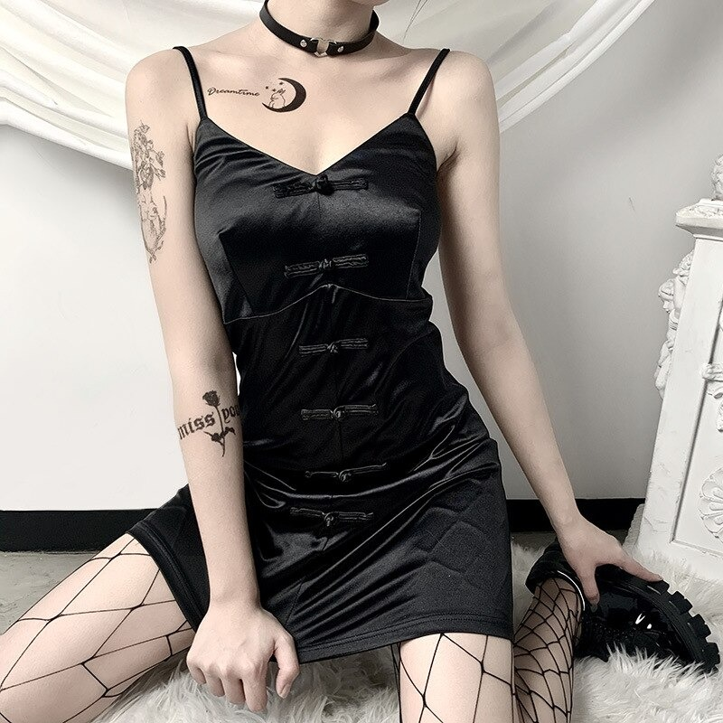Model showcasing a sexy black v-neck slim women's dress with bows and straps, perfect for gothic punk fashion.
