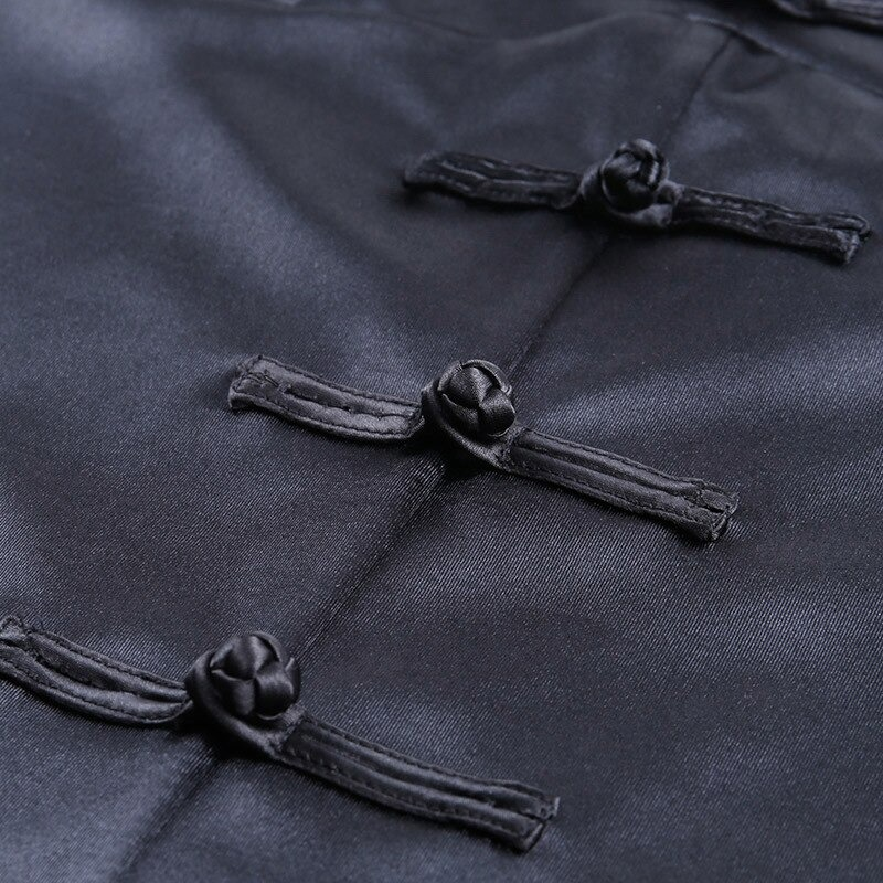 Close-up of decorative bows on a black gothic dress showcasing elegant craftsmanship for stylish outfits.