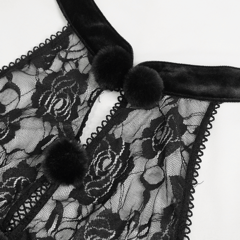 Close-up of a sexy black lace bodysuit with velvet halterneck and decorative pom-poms, showcasing gothic elegance.