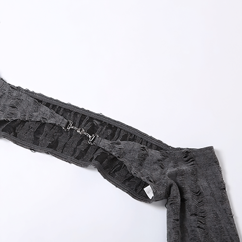 Close-up view of the stylish grey long sleeve top showcasing its unique open shoulder design and textured fabric.