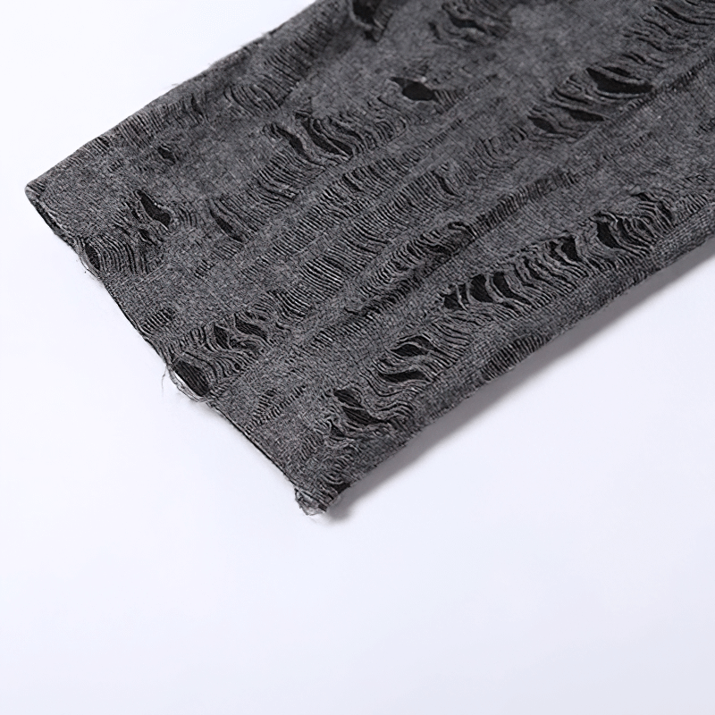 Close-up of a stylish gray fabric featuring trendy distressed patterns, ideal for women's casual fashion.
