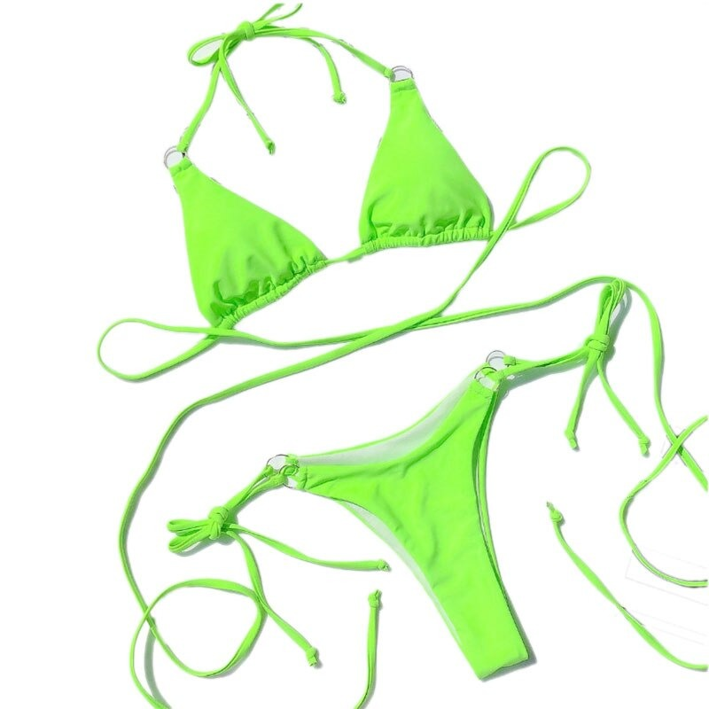 Vibrant green women's bikini set with adjustable tie strings, perfect for summer swimming and beach fun.