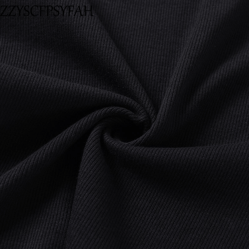 Close-up of soft black ribbed fabric, perfect for a sexy off-shoulder women's bodysuit.