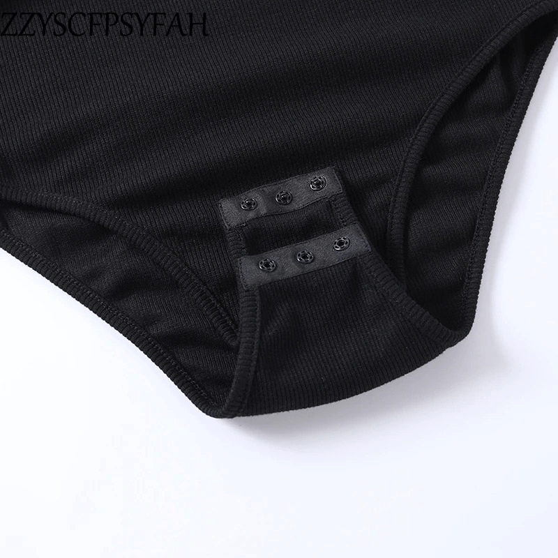 Close-up of a sexy black ribbed bodysuit's snap closure detail, highlighting the off-shoulder aesthetic style.
