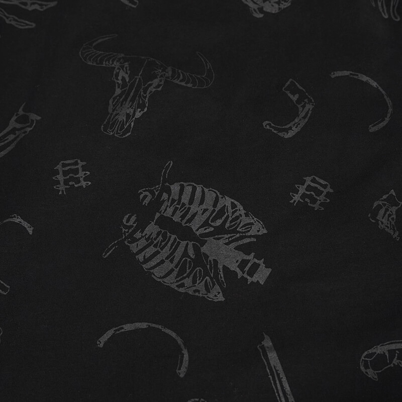 close-up of gothic black fabric featuring skull and bone patterns, perfect for stylish alternative fashion