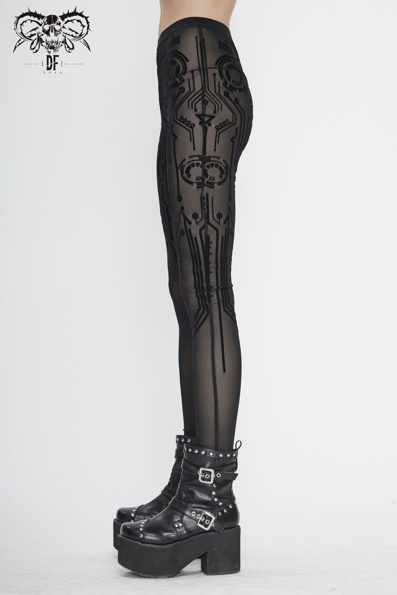 Stylish women's elastic black leggings with cyberpunk print, showcasing a modern look paired with chunky platform boots.