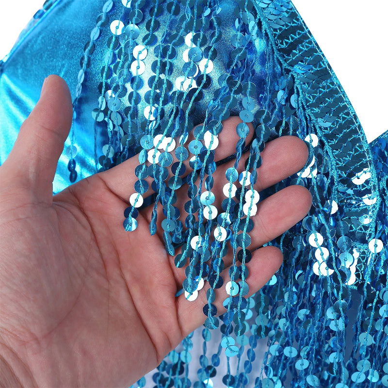 Close-up of a hand holding shiny blue sequins on a sexy women's crop bra top, perfect for performances and nights out.