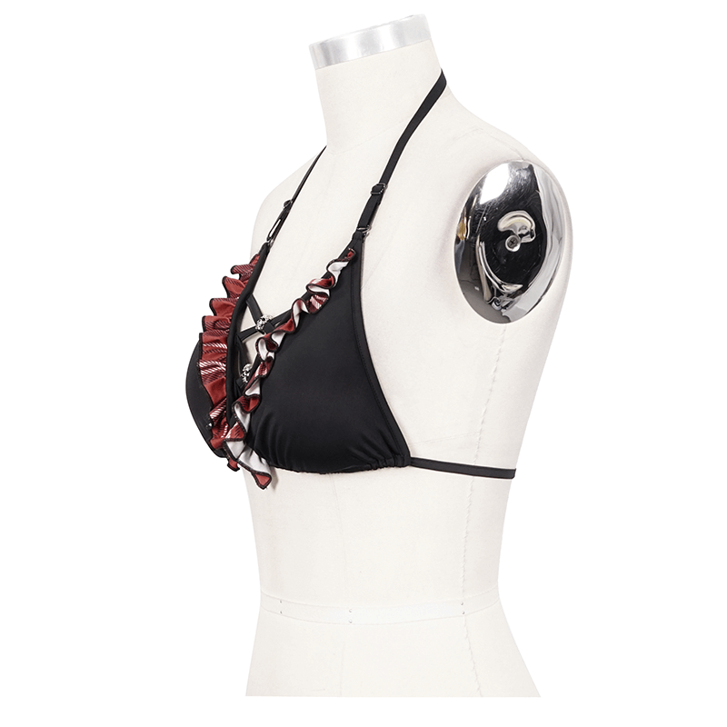 Sexy black and red plaid bikini top with skull pendants, showcasing a grunge design on a stylish mannequin.