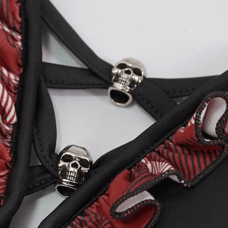Close-up of a sexy black and red bikini top featuring skull pendants for a trendy grunge look.