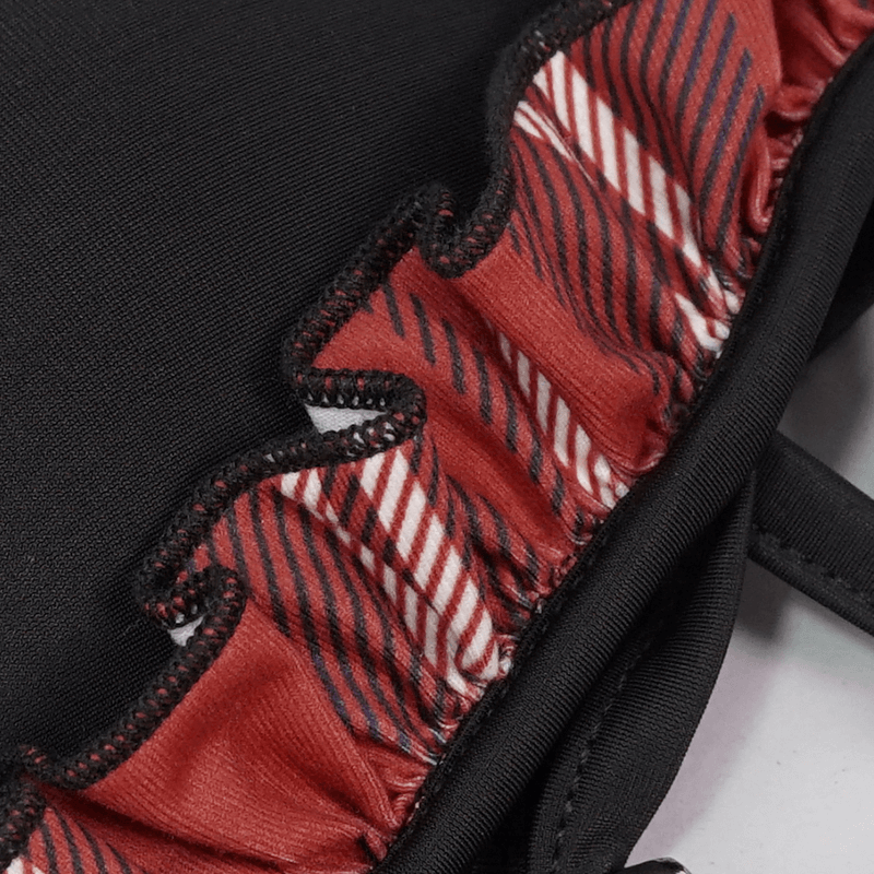 Close-up of sexy women's grunge bikini top featuring black and red plaid detailing with stylish ruffles.