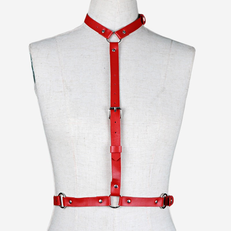 Red women's leather body harness, adjustable for gothic fashion and alternative style, featuring durable synthetic leather.