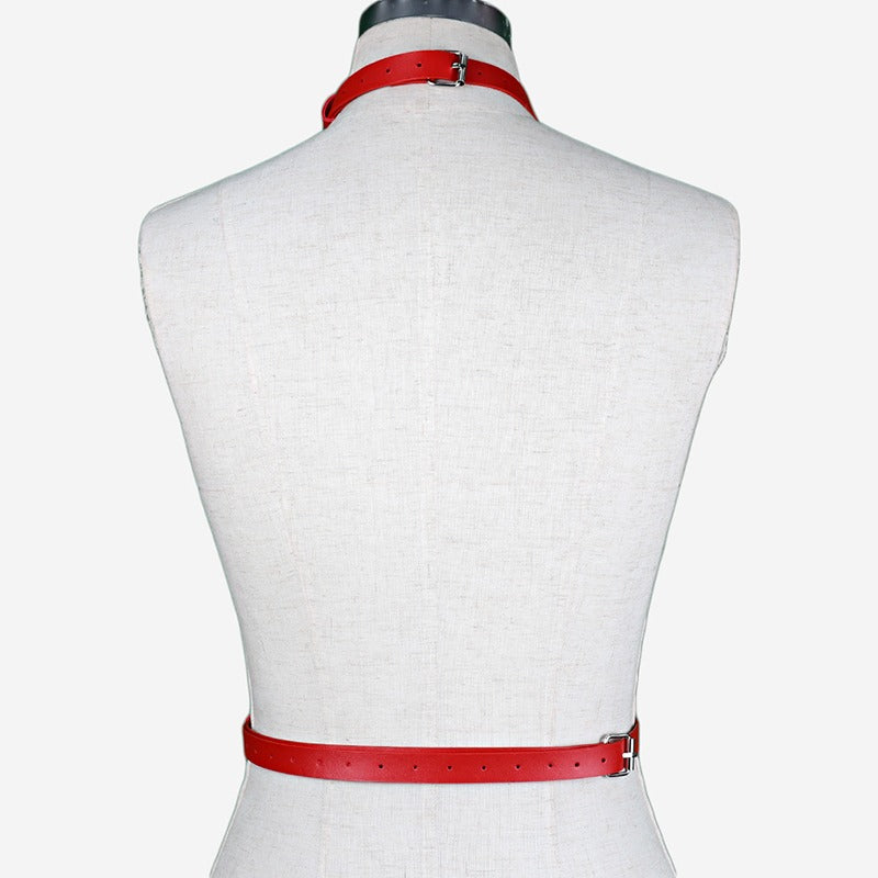 Red women's leather body harness showcasing adjustable straps for alternative and gothic fashion.
