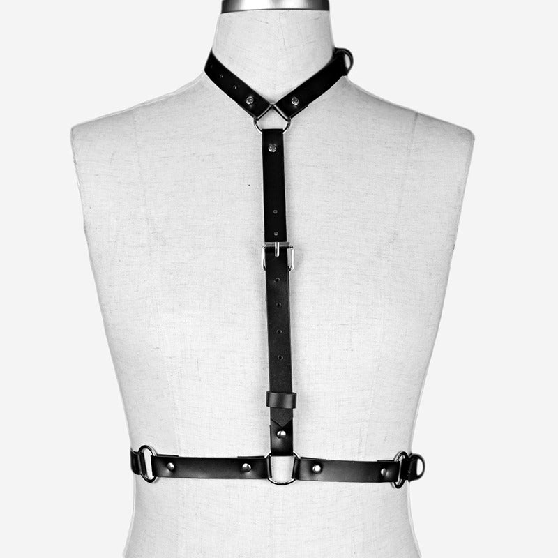 Adjustable women's leather body harness for goth and alternative fashion, featuring durable straps and metal rings.