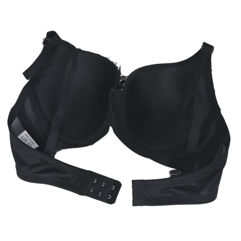 Black sexy women's rhinestone studded push-up bra with spikes in a rock style, perfect for bold fashion statements.