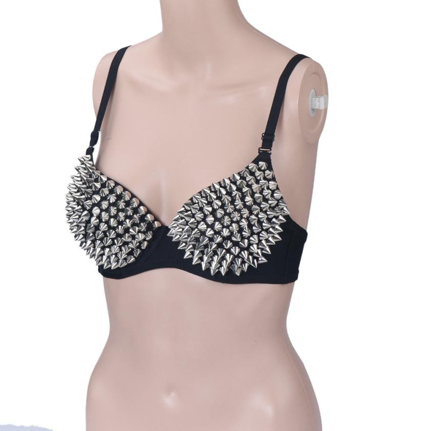 Edgy women's rhinestone studded bra with spikes, perfect for a bold rock style look.