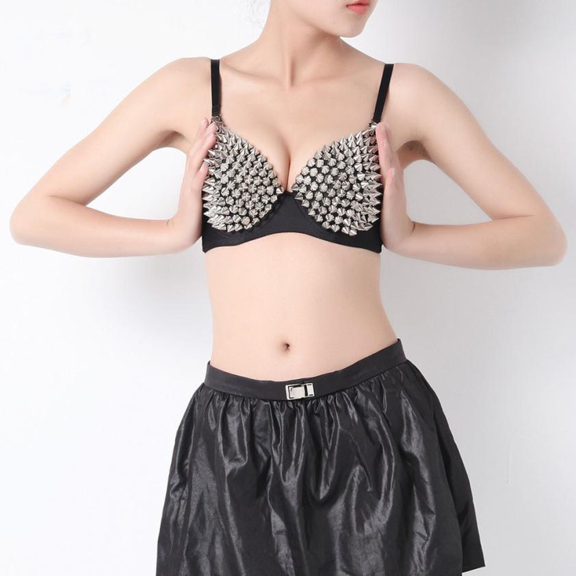Sexy women's rhinestone and spike bra showcasing edgy style, perfect for rock-inspired looks.