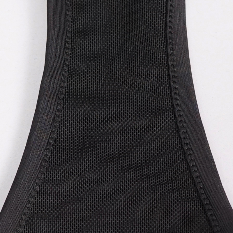 Close-up of the textured fabric of sexy women's swimming trunks in black with quality stitching details.