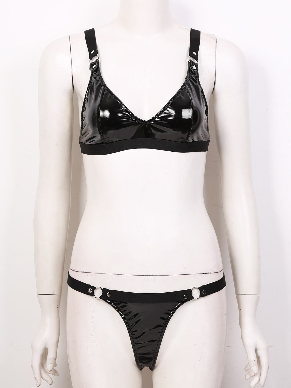 Sexy gothic women's lingerie set in black faux leather with elastic straps, including bikini bra and mini g-string.